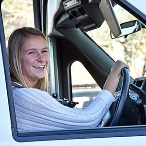 woman driving vehicle